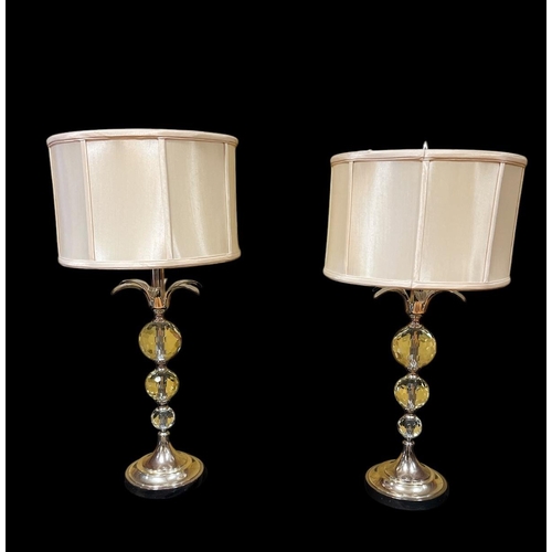 432 - A PAIR OF WHITE METAL AND GLAZED TABLE LAMPS each with a knopped faceted column above a circular spr... 