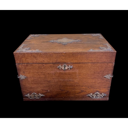 433 - A VINTAGE OAK AND PLATED BOUND CASKET the hinged lid with removable trays flanked on each side by pl... 