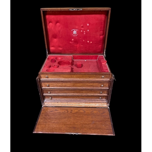 433 - A VINTAGE OAK AND PLATED BOUND CASKET the hinged lid with removable trays flanked on each side by pl... 