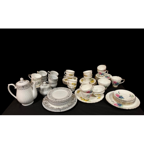 478 - A TWENTY ONE 0PIECE BONE CHINA TEA SET the white ground with stylised floral border, A TWENTY PIECE ... 