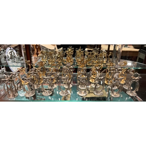 521 - A THIRTY TWO PIECE METAL HANDCRAFTED CHESS SET