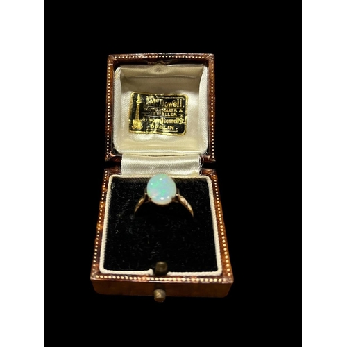 552 - A 9CT GOLD THREE STONE OPAL DRESS RING together with A 9CT GOLD SINGLE STONE DRESS RING (2) both siz... 