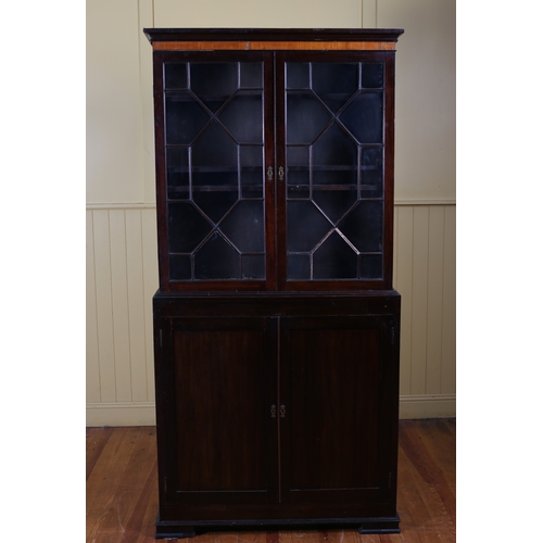 561 - A GEORGIAN MAHOGANY BOOKCASE the moulded cornice above a pair of astragal glazed doors with adjustab... 