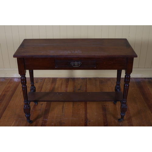 62 - AN EDWARDIAN MAHOGANY SIDE TABLE of rectangular outline the shaped top with frieze drawer on turned ... 