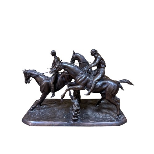 458 - after ISIDORE JULES BONHEUR A fine bronze group modelled as race horses and jockeys jumping a fence ... 