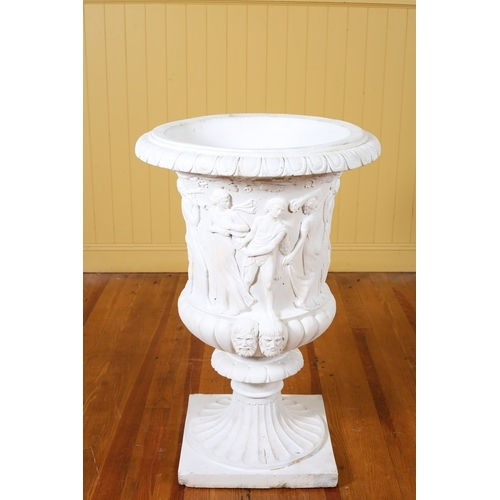 136 - A CONTINENTAL WHITE COMPOSITION URN of semi lobed campana form moulded in relief with classical figu... 