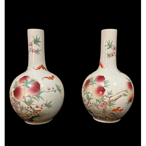 291 - A PAIR OF CHINESE PORCELAIN VASES each of bulbous form the opaline ground decorated with bats, fruit... 