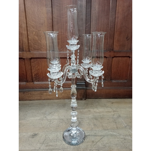 292 - A CONTINENTAL CUT GLASS FIVE BRANCH TABLE CANDELBRUM with trumpet shaped shades above cut glass drip... 