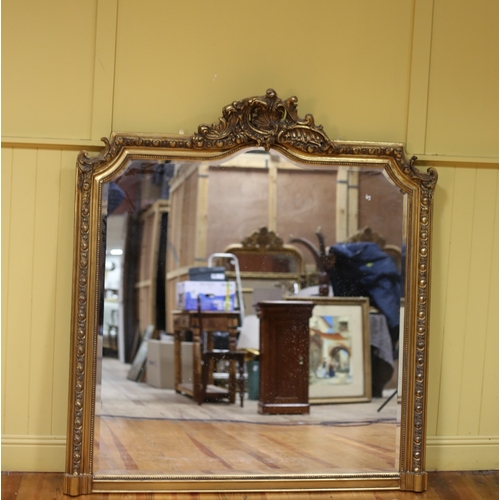 314 - A CONTINENTAL GILT FRAME MIRROR the rectangular arched bevelled glass plate within a beadwork stylis... 