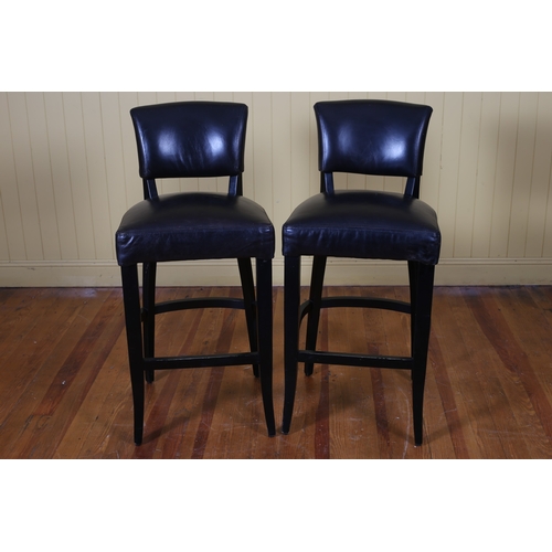 391 - A PAIR OF EBONISED DESIGNER AND HIDE UPHOLSTERED HIGH STOOLS with curved upholstered back and seat o... 