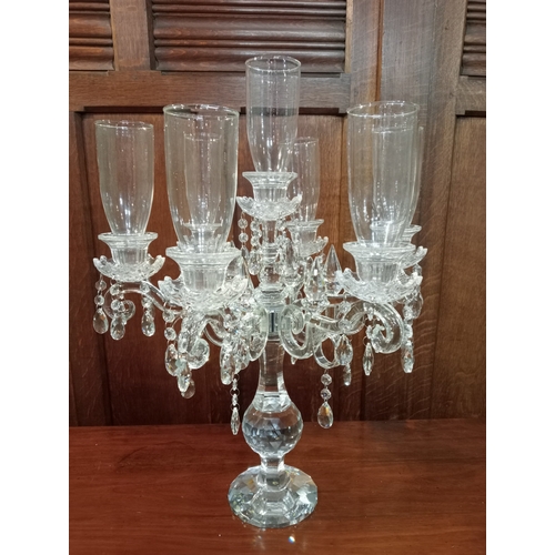 426 - A CONTINENTAL SEVEN BRANCH TABLE CANDELBRUM with trumpet shaped shades and drip pans hung with facet... 