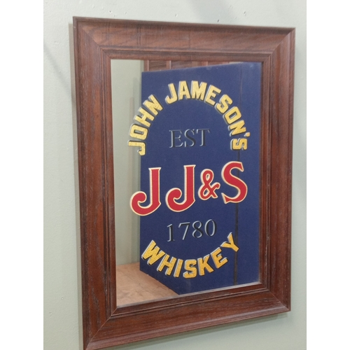 628 - A WHISKEY ADVERTISING SIGN inscribed 'John Jameson's Whiskey 1780' in oak frame 66cm (h) 51cm (w)