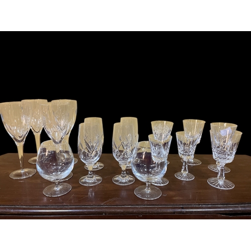 122 - A SET OF FOUR JOHN ROCHA WATERFORD CUT GLASS WINE GLASSES (1 AF), a set of four moulded glass wine g... 