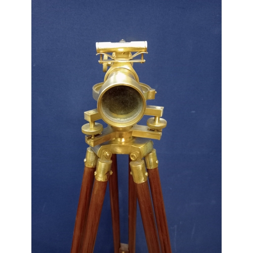 205 - A MAHOGANY AND BRASS SURVEYOR'S LEVEL mounted on a telescopic tripod support 130cm (h) x 50cm (h) x ... 