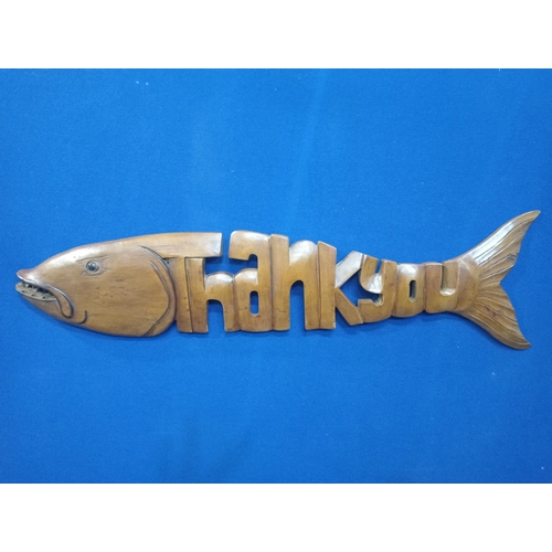 295 - A CARVED WOOD FIGURE in the form of fish inscribed 'Thank You'