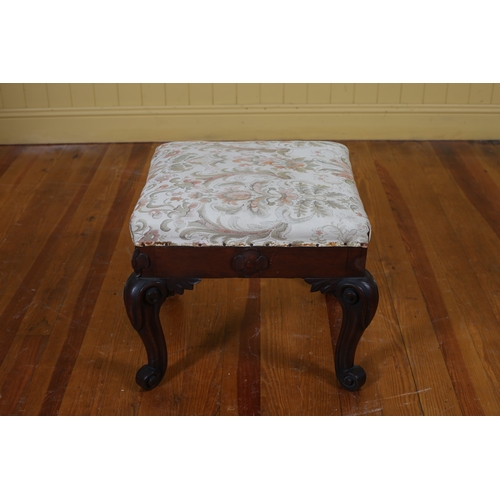 362 - A MAHOGANY STOOL the rectangular upholstered seat raised on carved cabriole legs with scroll toes 42... 