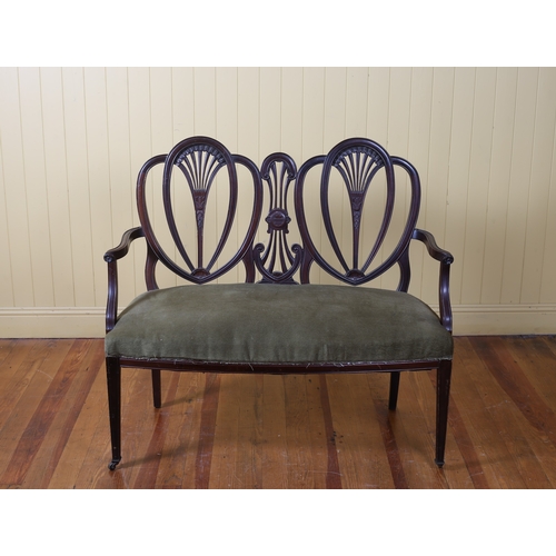 37 - A HEPPLEWHITE STYLE MAHOGANY DOUBLE CHAIR BACK SETTEE the arched top rail with pierced vertical spla... 