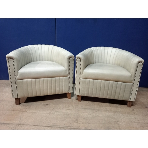 393 - A PAIR OF LEATHER UPHOLSTER TUB SHAPED CLUB ARMCHAIRS with ribbed back and sides on square tapering ... 