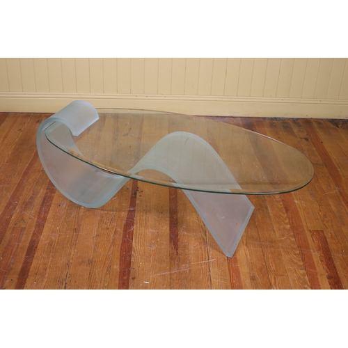 400 - A DESIGNER CLEAR GLASS AND FROSTED GLASS COFFEE TABLE the oval bevelled glass top raised on a froste... 