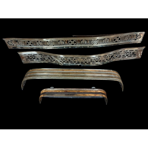 412 - TWO GEORGIAN PIERCED BRASS AND ENGRAVED FENDERS each of rectangular bowed outline together with TWO ... 