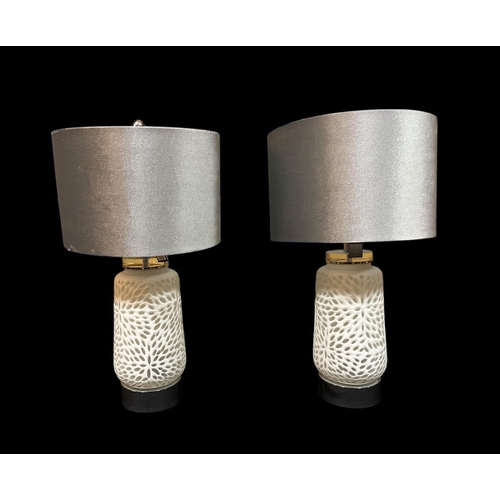 418 - A PAIR OF ASHFORD COLLECTION TABLE LAMPS the frosted and  mottled glass column's raised on chrome pl... 