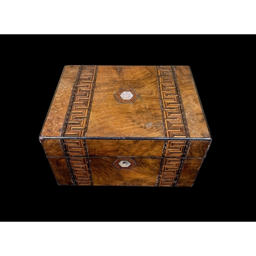 419 - A 19TH CENTURY WALNUT INLAID WRITING CASE the hinged lid containing a fitted interior with pen trays... 