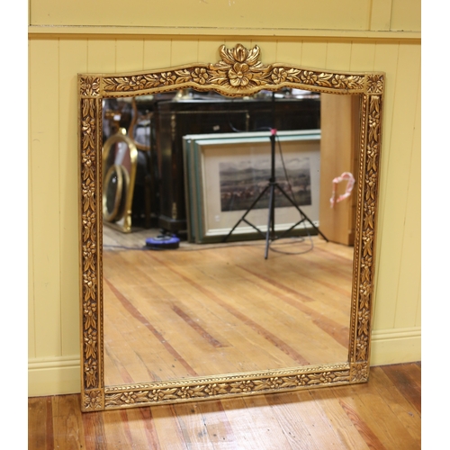 464 - A CONTINENTAL GILT FRAME MIRROR the rectangular shaped plate within a flowerhead and foliate carved ... 