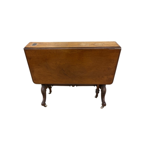 469 - A 19TH CENTURY MAHOGANY SUTHERLAND TABLE the rectangular hinged top raised on a baluster support wit... 