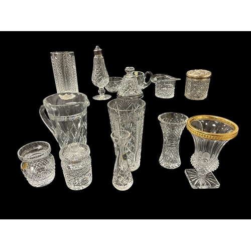 483 - A COLLECTION OF CUT GLASS to include some Waterford cut glass examples, Cavan cut glass, etc. On two... 