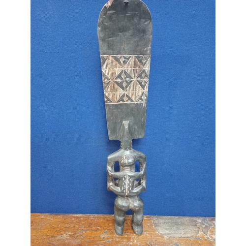 496 - AN AFRICAN HARDWOOD CARVED FIGURE modelled as a female 60cm (h) 13cm (w) 7cm (d)