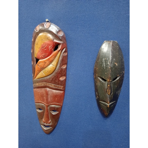 497 - A PAIR OF VINTAGE AFRICAN HARDWOOD CARVED WALL HANGING MASKS 45cm (h) x 15cm (w), 30cm (h) x 10cm (w... 