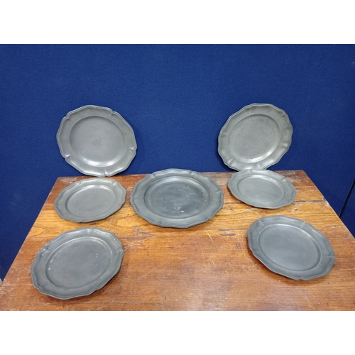 499 - A COLLECTION OF SEVEN PEWTER PLATES various sizes 1 x 30cm (Dia),  2 X 27cm (Dia), 4 x 22cm  (Dia)