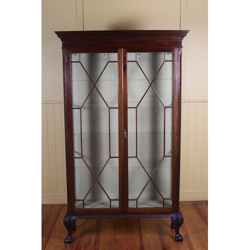 5 - A CHIPPENDALE STYLE MAHOGANY DISPLAY CABINET the dentil moulded cornice above a pair of astragal gla... 