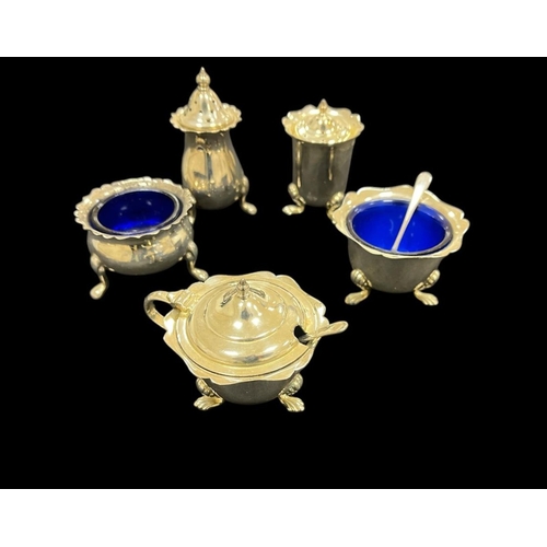 528 - TWO THREE PIECE SILVER CONDIMENTS SETS with bristle blue liners and THREE SILVER SPOONS (9) 297g