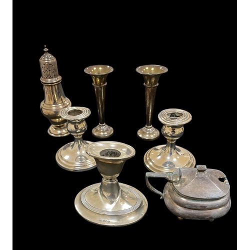 532 - A COLLECTION OF SILVER to include a pair of silver desk candlesticks, a pair of miniature silver vas... 