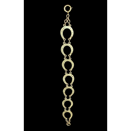 545 - A 9CT GOLD HORSESHOE LINK BRACELET