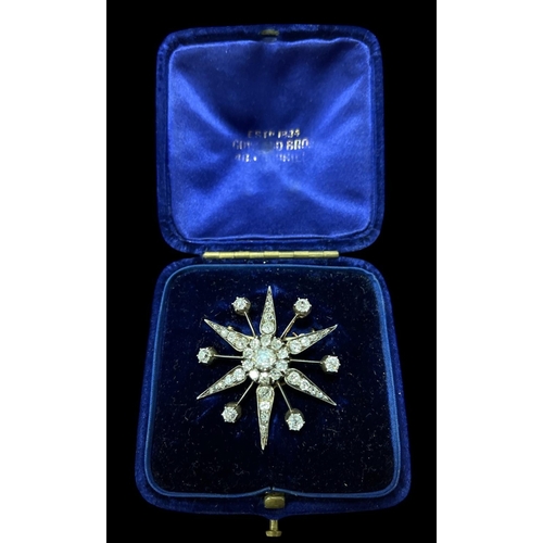 554 - A VICTORIAN GOLD SILVER AND DIAMOND STAR BROOCH