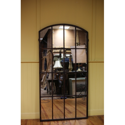 613 - A STAINED WOOD COMPARTMENTED MIRROR of rectangular arched outline 209cm (h) x 108cm (w)