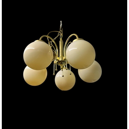 644 - A PAIR OF BRASS SIX BRANCH CHANDELIERS each with a faceted column issuing six scroll arms with glaze... 