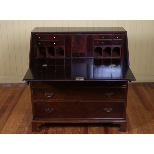 8 - A 19TH CENTURY MAHOGANY BUREAU the hinged writing slope containing pigeon holes and drawers above fo... 