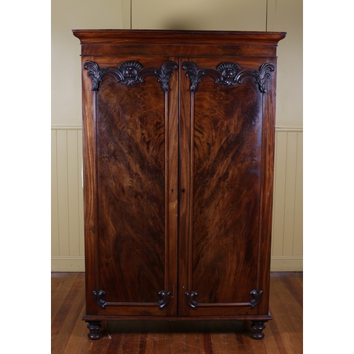 1 - A VICTORIAN MAHOGANY TWO DOOR WARDROBE the moulded cornice above a pair of panel doors with applied ... 