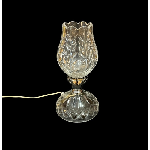 110 - A WATERFORD CUT GLASS TABLE LAMP the bulbous tapering shade above a circular spreading foot 33cm (h)