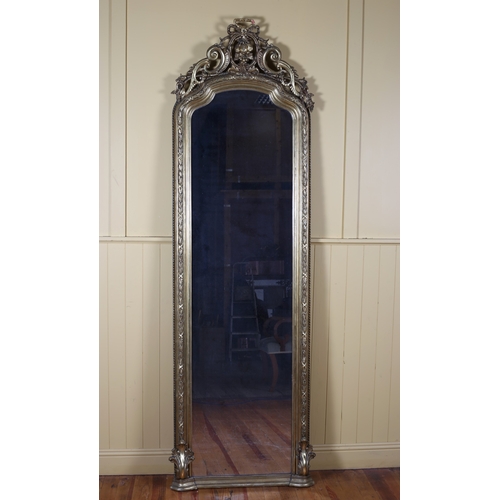 151 - A 19TH CENTURY GILTWOOD AND GESSO MIRROR the rectangular arched plate within laurel wreath strapwork... 