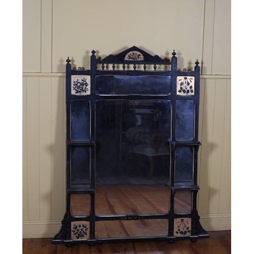 165 - A VINTAGE EBONISED PARCEL GILT AND PAINTED COMPARTMENT OVERMANTEL MIRROR the rectangular frame with ... 