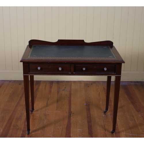 18 - A VINTAGE MAHOGANY WRITING TABLE of rectangular outline the shaped top with tooled leather inset abo... 