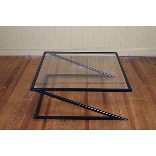 180 - A HARVINK MODEL Z COFFEE TABLE c.1980s the black metal tubular frame with glass inset on X-shaped su... 