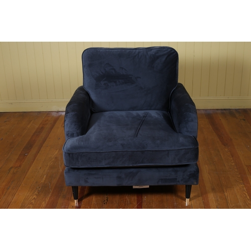 191 - A DESIGNER UPHOLSTERED ARMCHAIR with loose cushions and scroll arms on cylindrical tapering legs