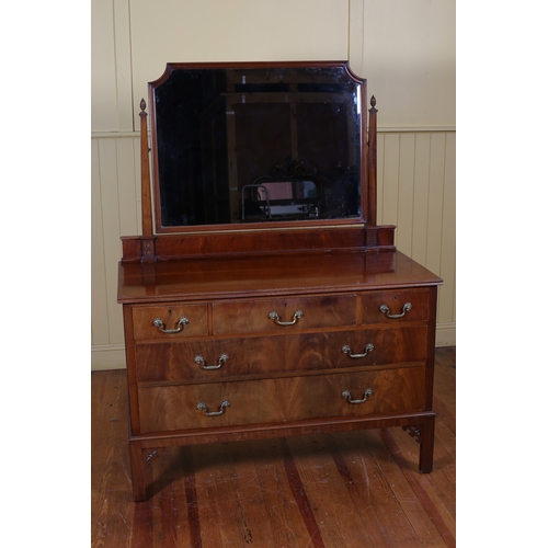 205 - AN EDWARDIAN MAHOGANY DRESSING TABLE the superstructure with bevelled glass swivel mirror above thre... 