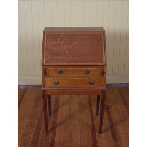 21 - A MAHOGANY INLAID BUREAU the hinged writing slope with tooled leather inset with pigeon holes and dr... 