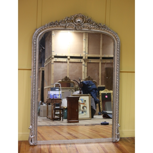 222 - A CONTINENTAL SILVER FRAME MIRROR the rectangular bevelled glass plate within a beadwork and gadroon... 